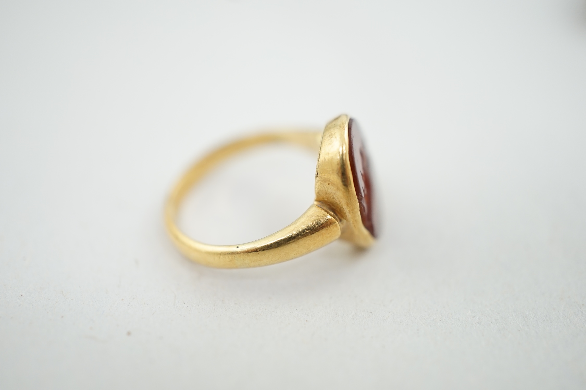 A Victorian 18ct gold and intaglio carnelian set child's signet ring